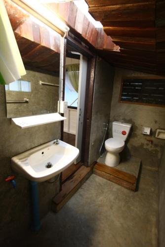 a bathroom with a sink and a toilet at Ocean front 2br 107sqm house - Panorama Sea View in Laem Ngop