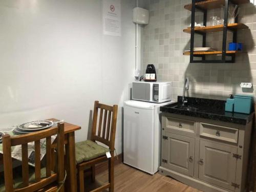 Kuchyň nebo kuchyňský kout v ubytování Studio Container Bombinhas