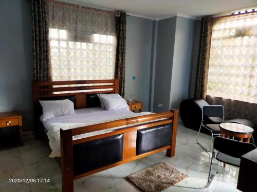 Postel nebo postele na pokoji v ubytování Aryana Furnished Apartment