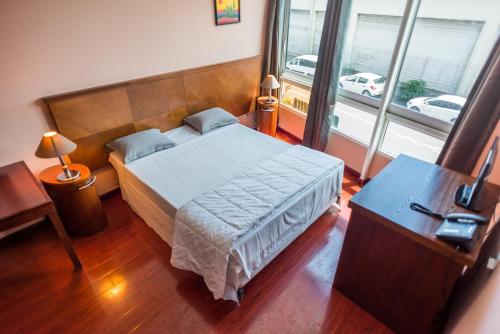 Un ou plusieurs lits dans un hébergement de l'établissement Hotel Sarah Nui