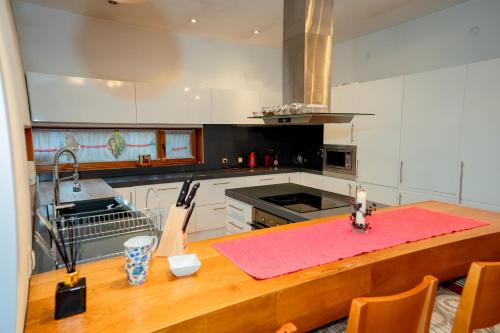 a kitchen with a table with a pink counter top at Luxury houses in Dobrinishte in Dobrinishte