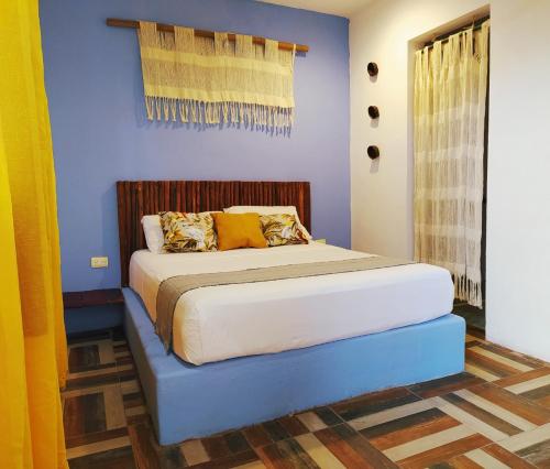 Voodi või voodid majutusasutuse Hotel Jardin Mahahual toas