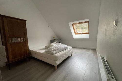מיטה או מיטות בחדר ב-Residence les bleuets