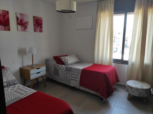 Giường trong phòng chung tại Departamento Ripozi Centro muy luminoso