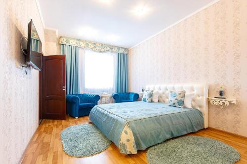 En eller flere senge i et værelse på Hotel Dvorets Svadeb