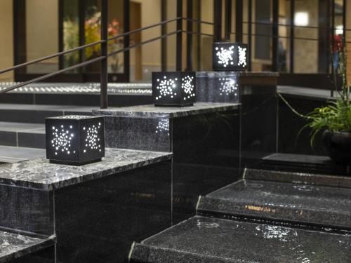 a group of black marble steps with lights on them at Onyado Nono Kyoto Shichijo Natural Hot Spring in Kyoto
