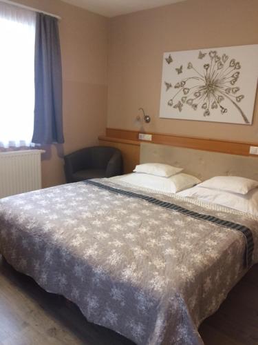 Postel nebo postele na pokoji v ubytování Hotel Zsida