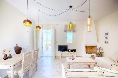 a living room with a couch and a table at Spacious Villa in Naxos with Sea View in Naxos Chora
