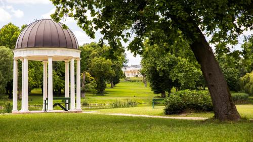 a gazebo in the middle of a park at Károlyi Kastély Hotel & Restaurant in Fehérvárcsurgó