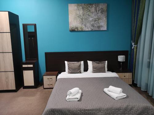Postel nebo postele na pokoji v ubytování Orange Hotel
