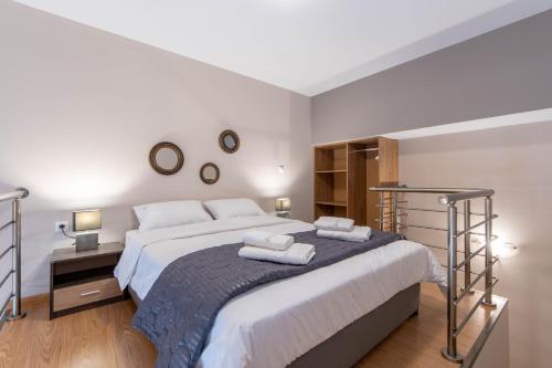 Katil atau katil-katil dalam bilik di Amaryllis Maison Hili