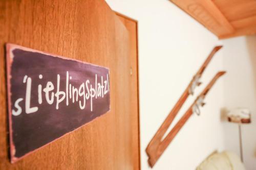 a sign on a door in a room at Haus Salina in Ellmau