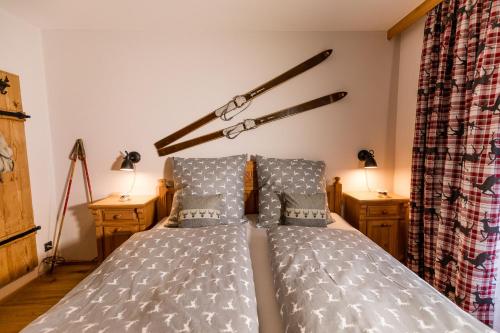 a bedroom with a bed and two night stands at Haus Salina in Ellmau