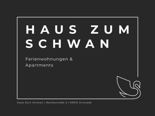 a sign that says haus zum salwwaan with a picture at Ferienwohungen und Apartments Haus zum Schwan in Arnstadt