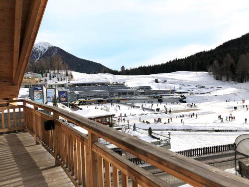 a group of people skiing on a ski slope at Chalet Bergzeit in Seefeld in Tirol