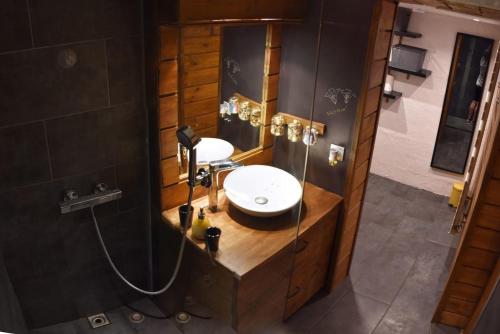 a bathroom with a sink and a shower and a mirror at Lovely 2 Bed Apartment in Morzine with garden in Morzine