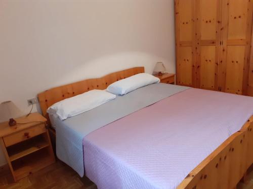 Katil atau katil-katil dalam bilik di Vacanzemoena - Casa del Moro