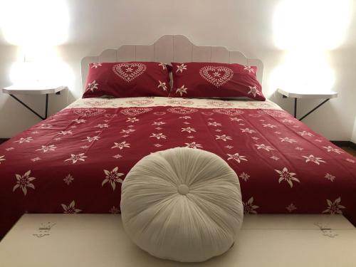 a bedroom with a bed with a large white orb on it at Il Bosco Guest House Subiaco in Subiaco