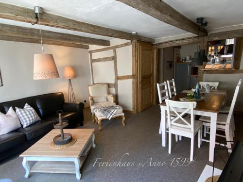 a living room with a couch and a table at Ferienhaus Anno 1599 in Wernigerode