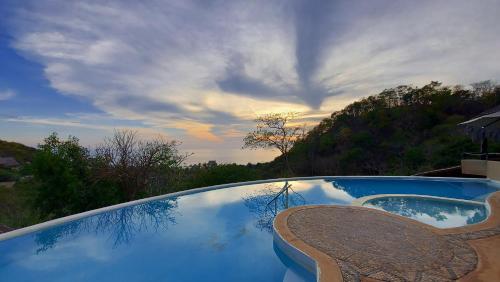 a reflection of the sky in a swimming pool at OceanoMar in Mazunte