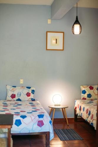 Ένα ή περισσότερα κρεβάτια σε δωμάτιο στο Azul Cielo Hostel
