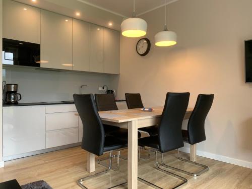 Kuchyňa alebo kuchynka v ubytovaní Apartament przy Olimpijskiej
