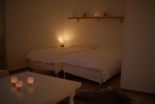 Ένα ή περισσότερα κρεβάτια σε δωμάτιο στο Lapland Stuga & Tours
