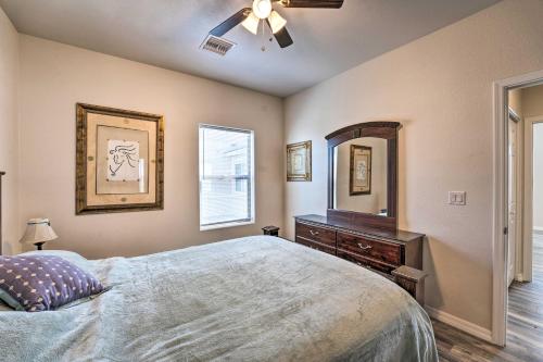 a bedroom with a bed and a dresser and a mirror at Pet-Friendly Retreat - 1 Block to Colorado River! in Bullhead City
