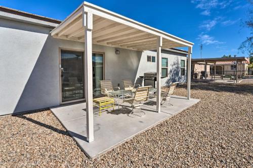 a pavilion with a table and chairs on a patio at Pet-Friendly Retreat - 1 Block to Colorado River! in Bullhead City