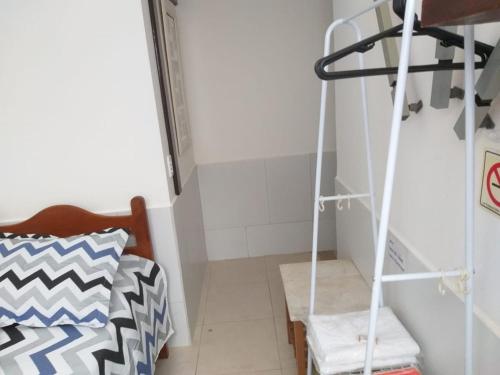 Ένα ή περισσότερα κρεβάτια σε δωμάτιο στο Recanto Suítes
