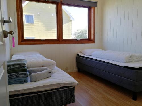 A bed or beds in a room at Lofoten Villa