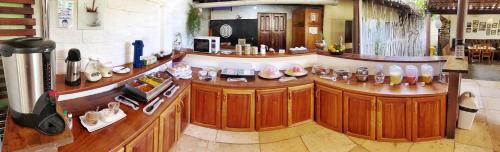 a room with a counter with many pairs of shoes at Villa Medina Jeri in Jericoacoara