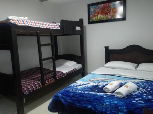 Cama o camas de una habitación en Hotel San Agustín