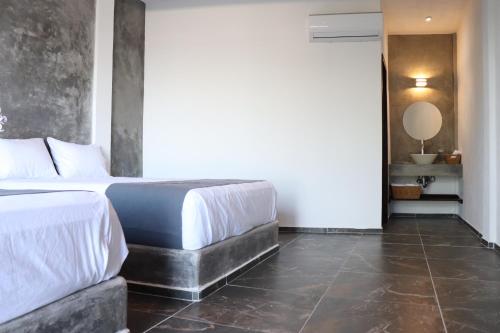 Postel nebo postele na pokoji v ubytování Hotel Lunazul In Costa Esmeralda