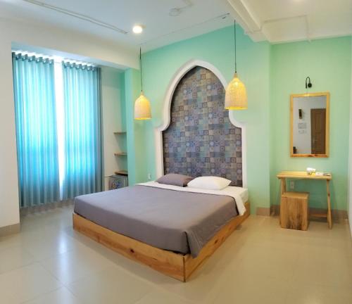 Giường trong phòng chung tại Joy Hotel Phú Yên