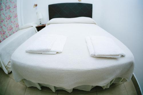 Postel nebo postele na pokoji v ubytování Hotel Tierra Colorada