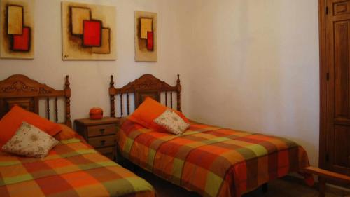 En eller flere senge i et værelse på Villa Joaquin - Casitas Select