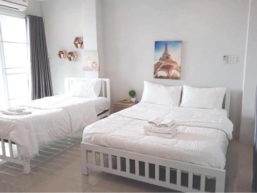 Postel nebo postele na pokoji v ubytování Lullaby Residence