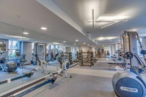 a gym with several treadmills and machines in it at Heaven On Baltimore at Harborfront in Baltimore