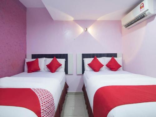 Кровать или кровати в номере Hotel Sunsurya