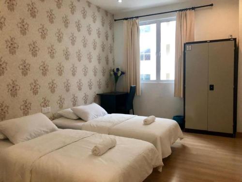 Postel nebo postele na pokoji v ubytování Island Hostel Bayan Lepas Airport