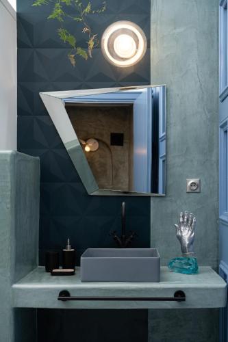 a bathroom with a sink and a mirror at Sunset View Villa with Swimming Pool & Heated Jacuzzi in Pyrgos