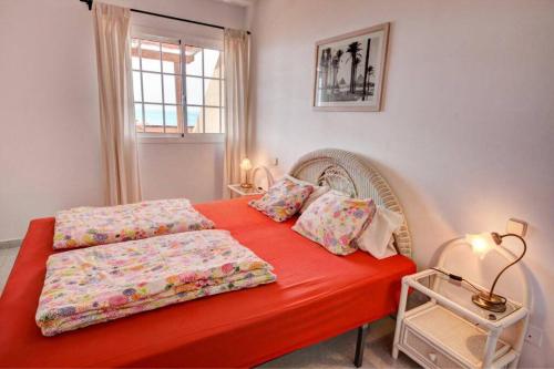 Postel nebo postele na pokoji v ubytování Wohnung direkt am Meer in La Lajita