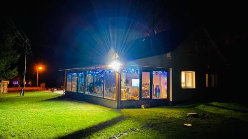 a building with a light on it at night at Chalupa u Bohumila in Rybná nad Zdobnicí