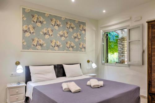 Ένα ή περισσότερα κρεβάτια σε δωμάτιο στο Seascape Elegant Residence Gouvia Marina