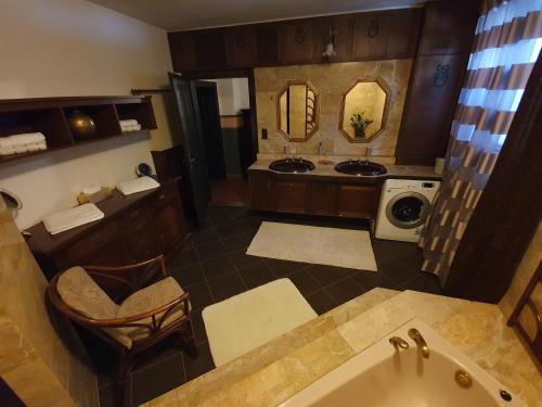 a large bathroom with a tub and a sink at Haus Irblingweg in Stiefern
