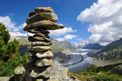 a pile of rocks sitting on top of a river at Eilander Sunshine in Fiesch