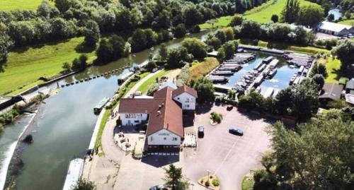 an aerial view of a marina next to a river at The Riverside inn in Saltford