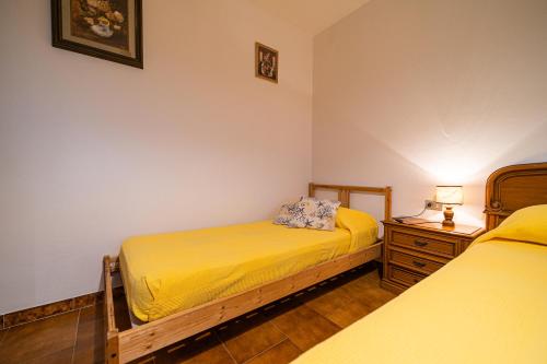 מיטה או מיטות בחדר ב-Le Isole - Goelba