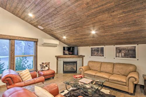 a living room with a couch and a fireplace at Cle Elum Lake Bunkhouse with Shared Hot Tub and Views! in Ronald
